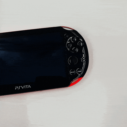 a white psvita video game console with buttons on the side
