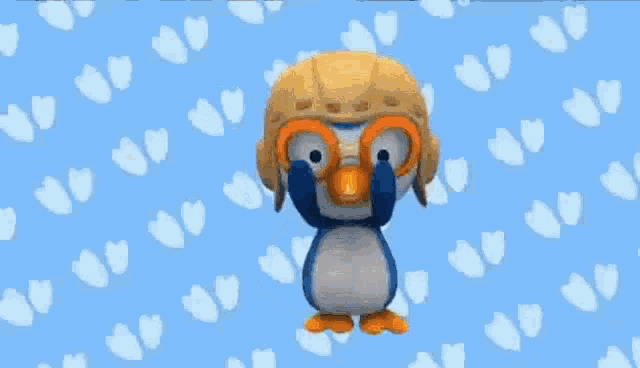 a cartoon penguin is wearing a helmet and goggles .