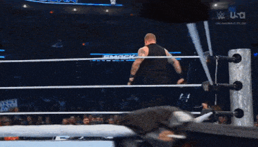 a wrestler in a wrestling ring with a sign that says " yeti "