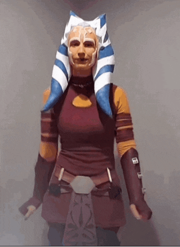 a woman in a star wars costume with a mask on her face