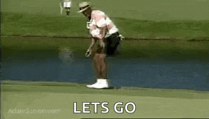 a man is standing on a golf course holding a golf club in his hand .