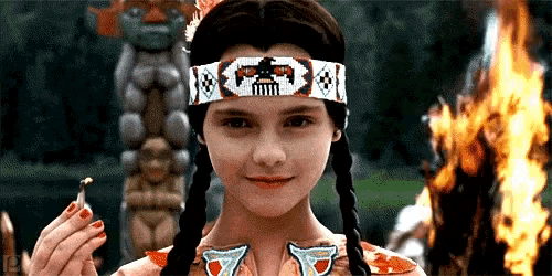 a young girl wearing a headband with a skull on it