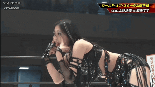 a woman in a wrestling ring with a stardom logo in the corner