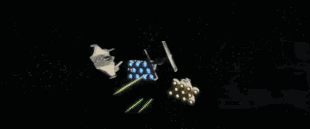 a group of spaceships are flying through space in a galaxy .