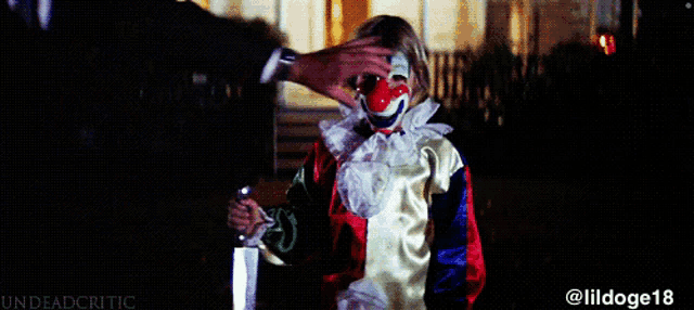 a person in a clown costume is holding a knife and has the hashtag @ lildoge18 on the bottom