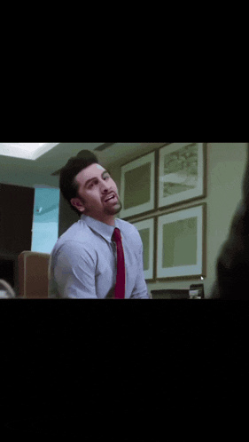 a man in a white shirt and red tie is making a funny face and the caption says keh do ki ye jhoot hai