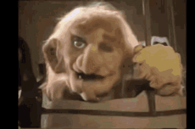 a close up of a cartoon character with a big nose and a mustache .