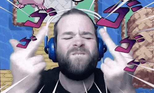 a man with a beard wearing headphones is giving the middle finger