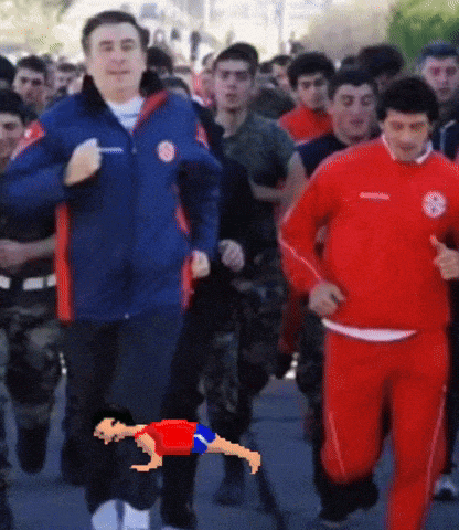 a man in a blue jacket is running with another man in red