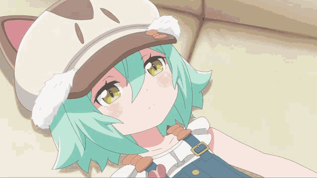 a girl with green hair and overalls wearing a cat hat