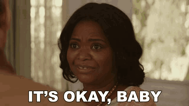 a woman says it 's okay baby while looking at another person