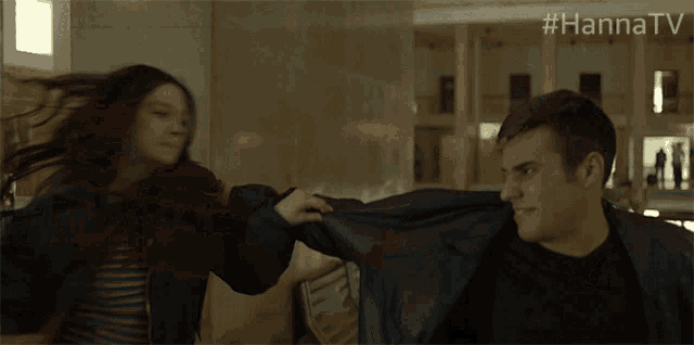 a man and a woman are fighting in a room with #hannatv written on the bottom