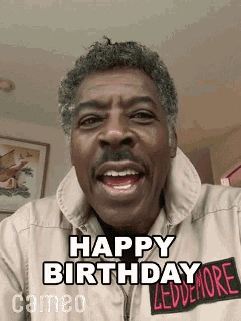 a man is wearing a jacket that says happy birthday ledemore