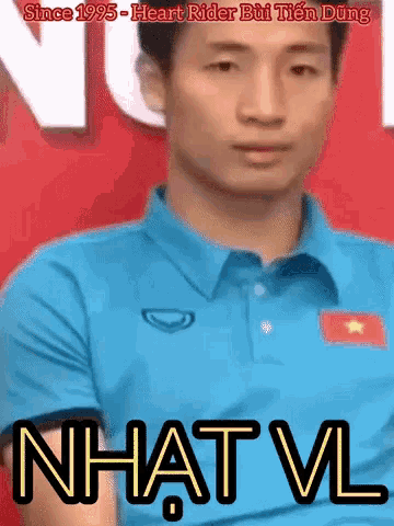a man wearing a blue shirt with a vietnamese flag on it