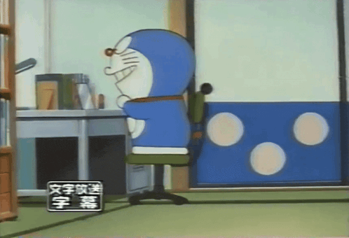 a cartoon of doraemon sitting in a chair in a room