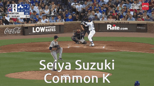 a baseball game is being played with seiya suzuki in the middle