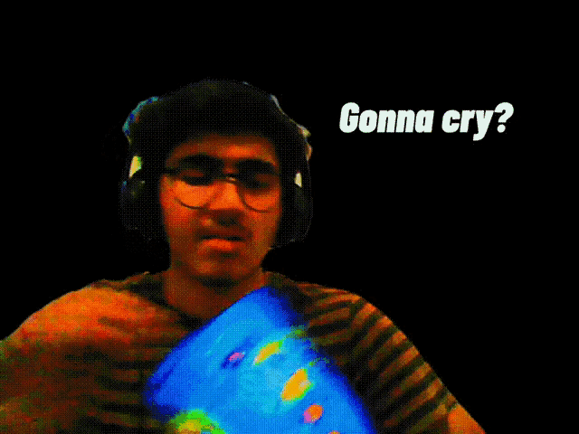 a man wearing headphones holds a bag of chips and says " gonna cry " in white letters