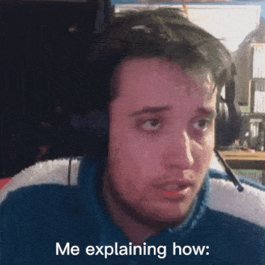 a man wearing headphones says me explaining how while looking at the camera