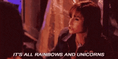 a woman is talking about rainbows and unicorns in a room .