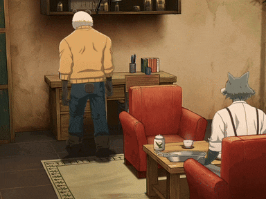 a man in a yellow jacket is standing in a living room next to a chair