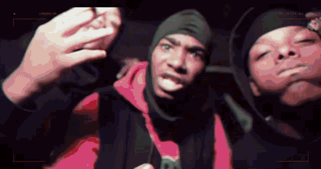 a group of men are taking a selfie with a camera that says " camera on "