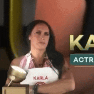 a woman wearing an apron with karla written on it