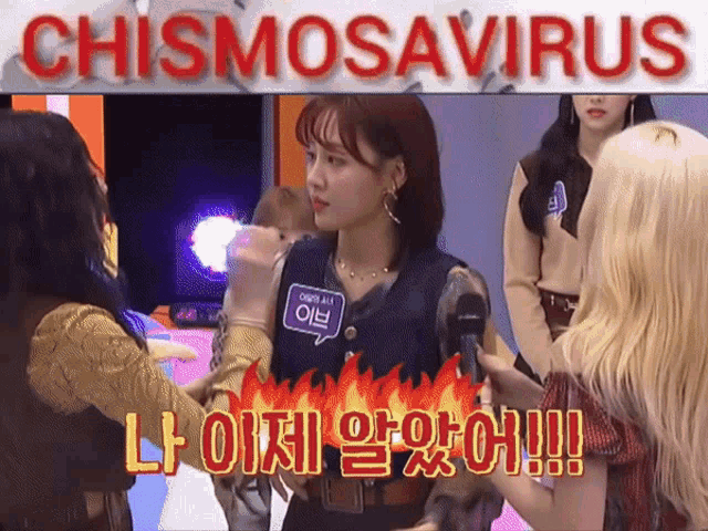 a group of asian girls are standing in front of a sign that says chismosaurus