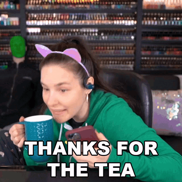 a woman holding a cup of tea with the words thanks for the tea