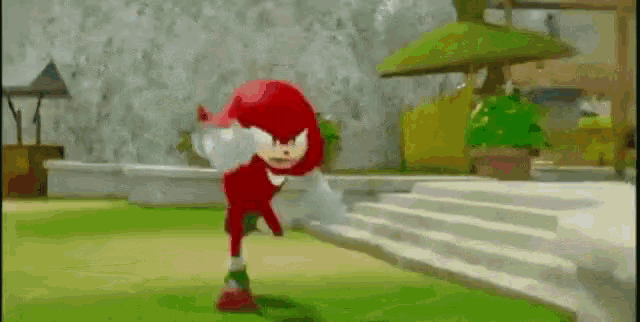 knuckles the echidna from sonic the hedgehog is standing in a park .