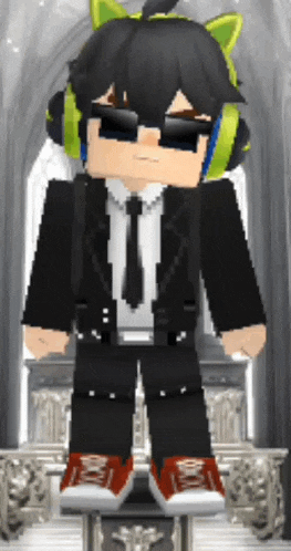 a boy in a suit and tie with headphones on