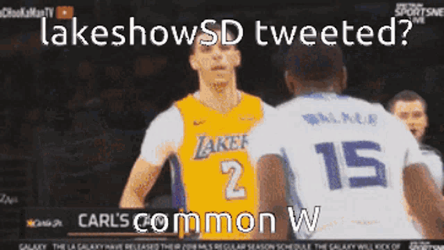 a basketball player with the number 2 on his jersey stands next to another player with the number 15 on their jersey
