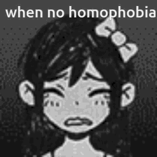 a girl with a bow in her hair is crying in a black and white photo .