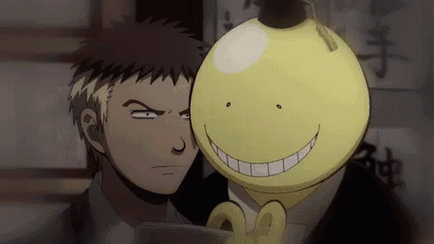 a man and a yellow cartoon character are standing next to each other and smiling .