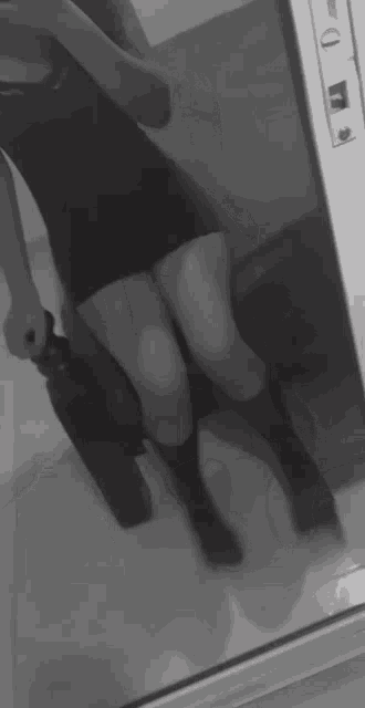 a blurry photo of a woman taking a selfie