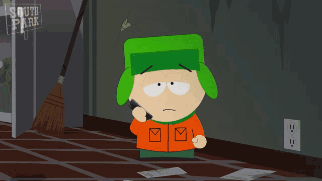 a cartoon character talking on a cell phone in front of a sign that says south park