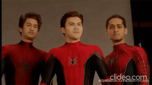 three men in spider man costumes are standing next to each other