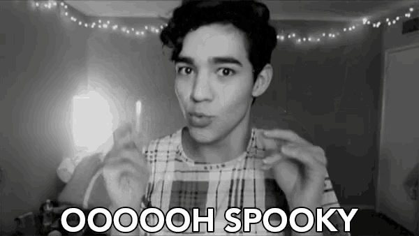 a black and white photo of a young man with the words spooky below him