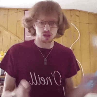 a man wearing glasses and a t-shirt that says lion 'o