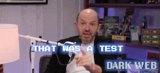 a man sitting in front of a microphone with the words that was a test dark web