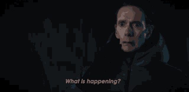 a man in a hooded jacket says what is happening