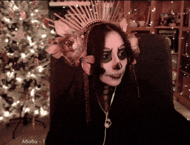 a woman with a skeleton face painted on her face