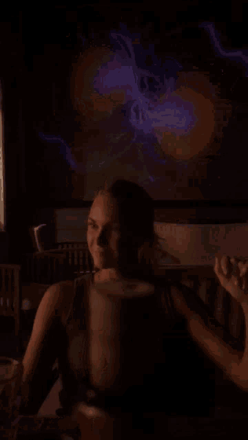 a blurry photo of a woman 's face with a purple background