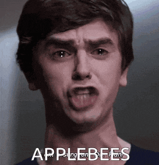 a close up of a man 's face with the words applebees in the corner