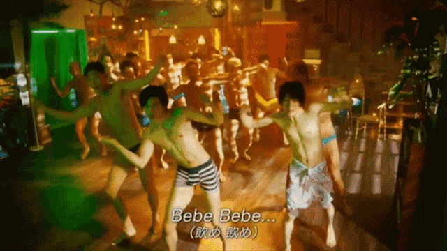 a group of men are dancing in a room with bebe bebe written in the corner