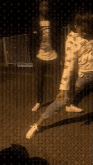 a blurry picture of a person standing on a street