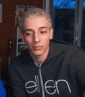 a young man wearing a sweatshirt that says ellen on it