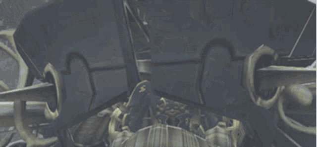 a video game character is sitting in a dark room with a clock on the wall