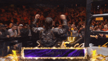 a man in a wrestling ring with the name adam cole on it