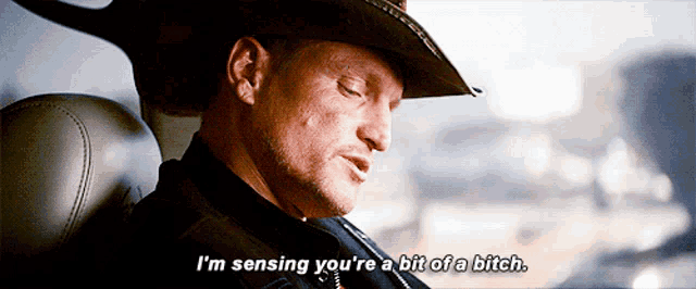 a man wearing a cowboy hat says i 'm sensing you 're a bit of a bitch