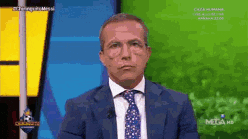 a man in a suit and tie on a mega hd channel
